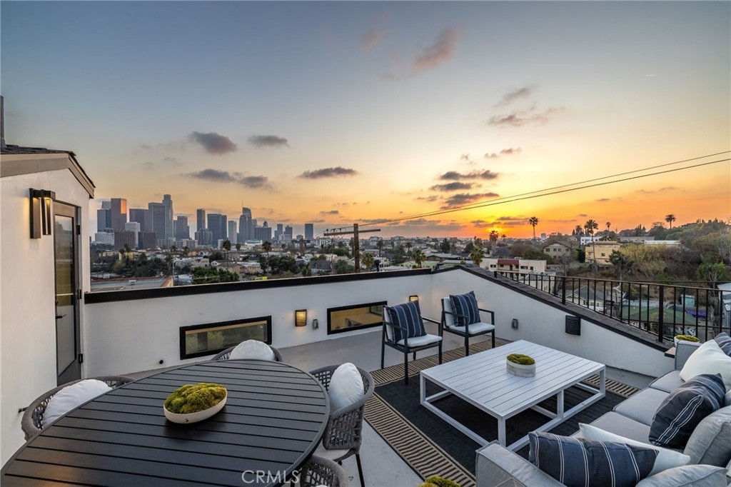 Final 2 Homes - Brand New Price! Introducing “The Everett Six”, a limited collection of six architecturally significant, Fully Detached Single-Family Homes in the heart of Echo Park with Panoramic Downtown LA Views. Each residence is situated on its own fee-simple lot with No Common Walls and showcases explosive Downtown Los Angeles skyline views from a private rooftop deck. Thoughtfully designed and meticulously built in 2025, these homes are positioned across from the iconic Everett Park and just steps from the vibrant energy of Sunset Blvd, with coffee shops, restaurants, and nightlife all within easy reach. Smart, sustainable, state of the art features include 6 solar panels fully paid off, LG all-electric multi-zone heating & cooling system (no gas combustion), EV charging infrastructure built-in, LG stainless steel kitchen appliance pkg + LG washer & dryer included. Curated Designer finishes include Cosentino porcelain countertops imported from Spain, Pottery Barn/Crate & Barrel light fixtures throughout, Artisan Italian & Spanish tile throughout, European white oak wood flooring and Oversized walls of glass and casement windows flood interiors with light. Smart home technology includes Yale remote electronic door lock, LG smart thermostats, Ring video doorbell, pre-wired A/V in all bedrooms & living areas. Each home’s private rooftop deck is the showpiece — with pre-plumbed gas and water lines ready for outdoor kitchens and gatherings. Enjoy unforgettable sunsets and skyline views, host friends under the stars, or create your own rooftop garden oasis — all with front-row panoramic views of Downtown LA.