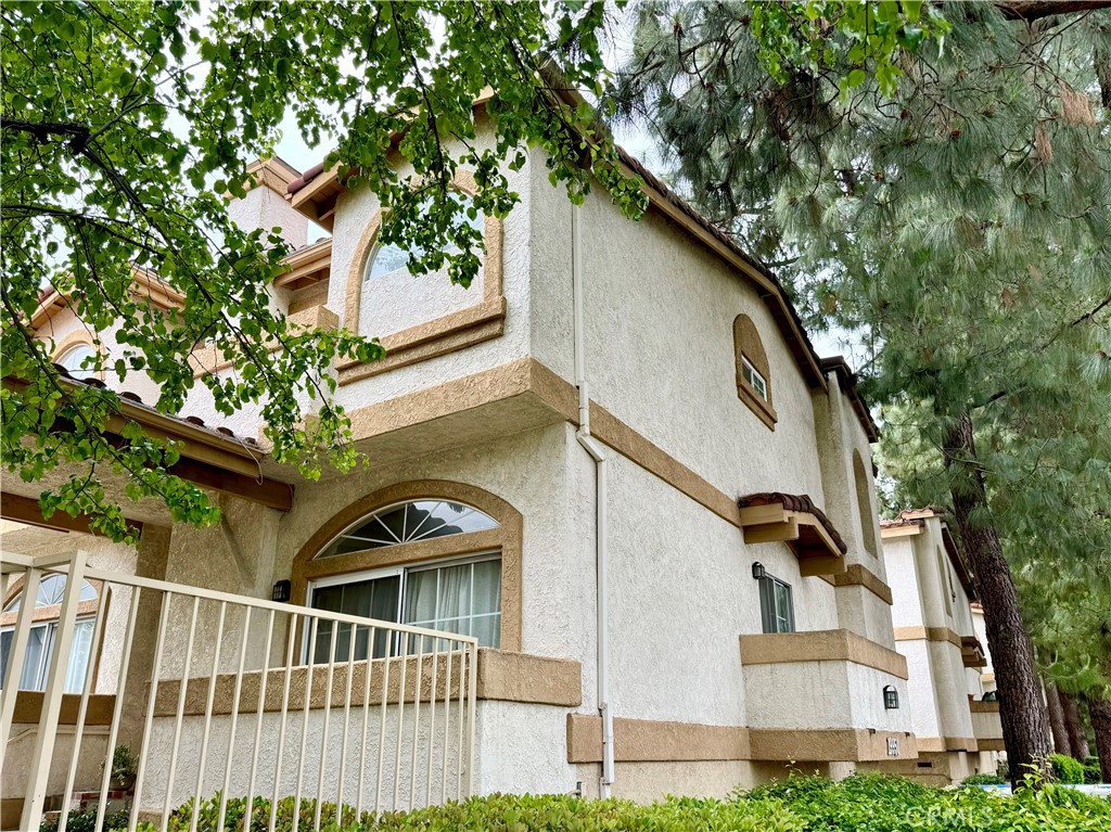 Reduced price!!Welcome to this beautiful, inviting multi-story townhouse in the heart of Winnetka. Ready move in- you enter into living room a cozy space with a fireplace that opens to the dining area, kitchen and family room. The kitchen has ample cabinets and pantry, stainless steel gas range, hood, dishwasher, single basin sink and tile floors that opens to the breakfast nook and family room. There are 2 master bedrooms upstairs with 3 balconies, including one in the master bedroom. Corner unit with only 1 shared wall for added privacy, newly installed insulation. Corner unit with only 1 shared wall for added privacy. Ample storage with 2 walk in closets, one in each master bedroom. A half bathroom on the main level and one bedroom & one bath downstairs with laundry area. Central air heat & cool. In the summer you will enjoy the sparkling swimming pool with large deck for sunning, spa and rec room for your birthday parties. Two attached garage with direct access to the unit. The complex is close Shopping centers, restaurants, schools, Pierce college, Freeway and Orange Line Transportation.