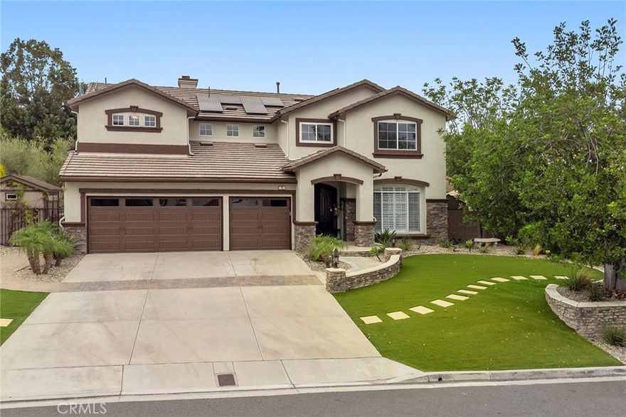 A rare opportunity in the privately gated neighborhood of Stonecliffe. This beautifully remodeled 5-bedroom, 3-bathroom home offers approx. 3,195 sqft of luxurious living space on a sprawling appx 17,594 sqft w over $500,000 in custom upgrades inside and out. Enter your oasis through custom iron double front door and be greeted by spacious sunken living and dining rooms with custom light fixtures and a designer accent wall, crown molding, luxury flooring, wood shutters & cased windows.  The gourmet kitchen showcases a GE stainless Café cooktop, GE double oven and microwave, stainless dishwasher and refrigerator, quartz counters and backsplash, custom cabinetry and center island, an extended island with bar seating, a farmhouse sink, and a charming breakfast nook with bay window and built-in bench. The spacious family room has volume ceilings, many cased windows for natural light, custom cabinetry and crafted stone and wood mantel. Hallway off the family room leads to large office/ bedroom w built-in’s ceiling fan and crown molding. Separate bathroom with custom vanity and shower.Large inside laundry with cabinets and convenient folding table. Custom wrought iron and wood stair rails. Luxurious primary suite with volume ceilings and crown molding. Spa like primary bath with custom tub and shower, custom dual vanities with stone counters. Huge walk-in closet with CA closet built-ins. Custom loft with built-ins w a stone top. Large secondary bedrooms w crown molding, mirrored wardrobe doors and built-in closet organizers. Truly one-of-a-kind entertainers backyard w an 18x18 pergola with 8-inch beams and AV hookups sits on a circular paver foundation, surrounded by split-level entertainment zones, patterned pavers throughout, oversized side yards, a custom 120sf finished cottage, a built-in BBQ island with stainless Bull grill and ice chest, 2 cozy fire pits, lighted half basketball court, turf play area, custom brick fencing, matching storage shed and a beautiful view of rolling hills. Additional highlights include paid for solar system, 2 large storage sheds on either side of the home.Upgraded Heritage garage door, epoxy garage floors, garage cabinetry, low-maintenance turf and rock landscaping, and window canopies on upper rear-facing rooms. Enjoy easy access to the gated HOA pool and spa,award-winning schools, hiking trails, Thomas F Riley Wilderness Park, and the 241 toll road — all within this exclusive, gated community.
