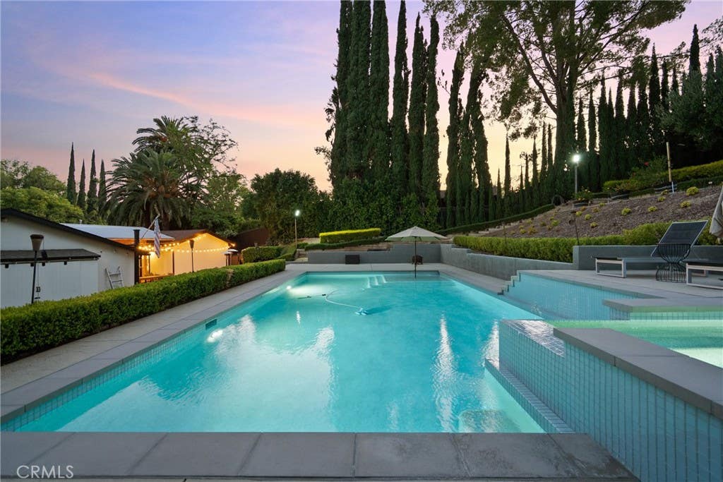 Photo of 6013 Lubao Avenue, Woodland Hills, CA 91367 (MLS # GD26181761)