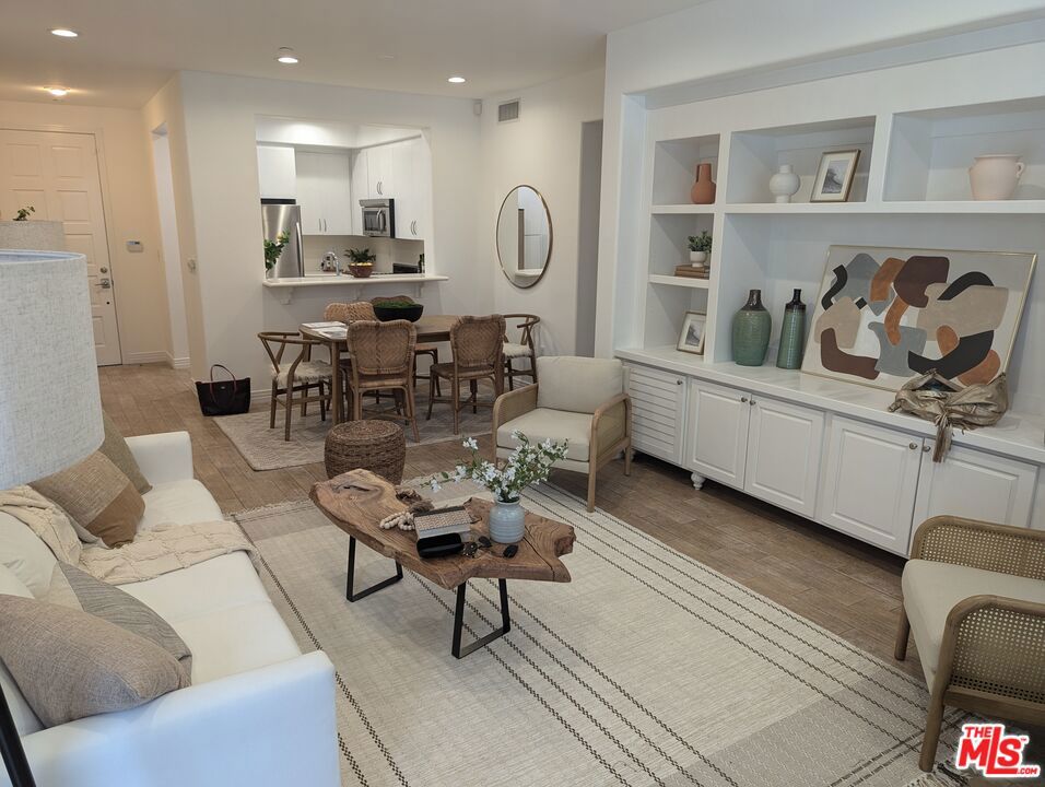 Step into Luxury in the most desired Playa Vista Neighborhood with all of the amenities of a Luxury Hotel. This stunning 2-bedroom, 2-bathroom, single-story condo corner unit. Tastefully designed home boasts a bright, open layout, seamlessly connecting the gourmet kitchen, dining area, and living room adorned with custom built-ins. The gourmet kitchen features exquisite stone countertops, premium stainless steel appliances, ample cabinet space, and a versatile area ideal for a desk, office, or breakfast nook. Your spacious private patio perfect for a BBQ, entertaining guests, or unwinding after a long day. Both bedrooms in this exquisite condo are ensuite and generously sized, each featuring spacious walk-in closets. The primary bedroom offers a haven of comfort, complemented by a luxurious bathroom with dual vanities, a separate walk-in shower, and a soothing soaking tub. In unit laundry closet is equipped with a stacked washer and dryer, along with additional cabinet space. The unit includes two parking spaces and extra storage. Residents enjoy access to an array of premier amenities, including the Center pointe Club pool and fitness center, The Resort, tennis courts, Concert Park, Runway Retail Center, and so much more. Embrace the vibrant Playa Vista lifestyle with unparalleled convenience and luxury at your doorstep.