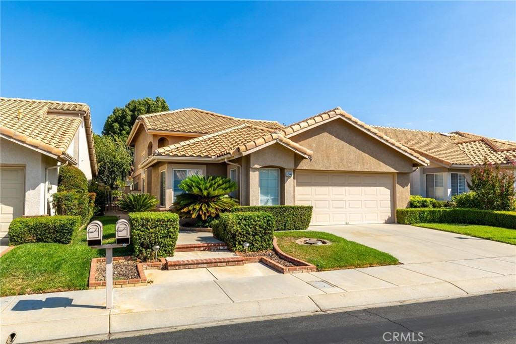 Situated on a 3,920 square foot lot in one of the most sought after 55+ active adult communities, you will find this beautiful 1849 square foot home. This 3 bedroom, 2.5 bath Muirfield floor-plan features a stunning remodeled kitchen, bathrooms and so much more. You are immediately greeted by an enchanting formal dining/living room, and high ceilings that offer a feeling of grandeur. A fabulous kitchen awaits any culinary enthusiast with gorgeous granite counter tops, custom cabinetry, expanded work area, and stainless steel appliances. This ktichen overlooks the cozy family room with a fireplace and plenty of room for fall gatherings. The primary bedroom suite is located on the main floor for convenience and offers a spacious bedroom with a large remodeled bathroom that features a splendid use of granite, tile, custom cabinets, and the walk-in closet is an added bonus. The second floor offers 2 guest bedrooms along with a versatile loft that can serve as an office or cozy reading nook. The beautifully remodeled bathroom provides guest with comfort and privacy in their own section of the home. An attached 2 car garage with golf cart parking and generous storage is sure to please anyone. The inviting backyard is ready for entertaining under an alum-wood patio cover with a ceiling fan, both adding a feeling of privacy and comfort. The attractive front and backyard are fully landscaped. Sun Lakes Country Club is a vibrant 55+ gated community where residents enjoy resort-style living with two golf courses, three clubhouse including a full-service restaurant and lounge, three swimming pools, tennis/bocce ball courts and an array of social activities. Retirement has never looked so amazing and affordable. Come and tour this lovely home today!
