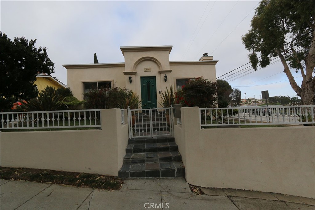 Less than a mile to the beach, this charming South Redondo Beach home boasts 3 bedrooms and 2 bathrooms. Hardwood floors in living room and bedrooms, travertine tiles in the kitchen, dining area, sunroom and bathrooms. The living room, sunroom, and two bedrooms have ceiling fans. The bedroom closets have beveled mirror sliding doors. The spacious kitchen with granite countertops, and maple cabinets provides plenty of storage, and has a built-in microwave above the gas range. Breakfast bar off the kitchen. Roof deck on top of garage. Walking distance to civic center, shops, schools, and the beach!