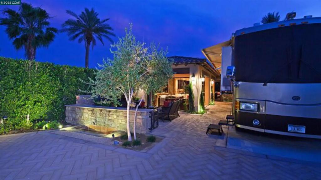 LOT 262 IS LOCATED ON THE SOUTH WALL OF MOTOR COACH COUNTRY CLUB WHICH HAS THE BEST SUN EXPOSURE. THE BUILDOUT WAS BUILT TO HIGHEST STANDARDS INCLUDING INTERIOR AND EXTERIOR PLASTER WALLS, TRAVERTINE STONE PLANK FLOORS, 3 HVAC UNITS. FULLY ENCLOSED LOGIA HAS ALL TOP END AMENITIES INCLUDES: BI-FOLDING FRAMELESS GLASS DOORS, WHICH IS PERFECT FOR BRINGING THE OUTDOORS IN. THE GOURMET KITCHEN FEATURES ALL HIGH-END APPLIANCES INCLUDING A SUB-ZERO GLASS FRONT REFIRGERATOR AND FREEZER. COMMERCIAL WOLF RANGE OVEN SHARP UNDER-COUNTER MICROWAVE DRAWER AND A ASKO INTEGRADED DISHWASHER. CUSTOM CABINETS WITH HIGH END GRANITE COUNTER TOPS. KWC POT FILL. JENN-AIR BEVERAGE CENTER AND SUB-ZERO CLEAR ICE MACHINE.THE CASITA HAS A QUEEN SIZE MURPHY BED..ASKO UNDER-COUNTER PANNELED WASHER AND DRYER AND HIGH END BATHROOM. SUFFICENT PARKING AND A FULL COURTYARD COMPLETE WITH FIREPLACE. THE REAR YARD AND FRONT YARD FEATURES WATER FEATURES INCLUDING A FIREWALL IN THE REAR YARD. 48'' ALFRESCO GRILL BUILT INTO CUSTOM ISLAND WITH STAINLEESS-STEEL STORAGE. THE AMMENTIIES INCLUDE AN 18 HOLE PAR 3 GOLF COURSE. 24 HOUR MANNED GATE. FULL SERVICE RESTURANT. PICKLE BALL AND TENNIS COURTS. 3 HEATED COMMUNITY POOLS AND A GYM.1.8 MILES OF SCENIC WATER WAYS FOR BOATING.THERE IS AN HOA , DUES ARE $760.00 PER MONTH.