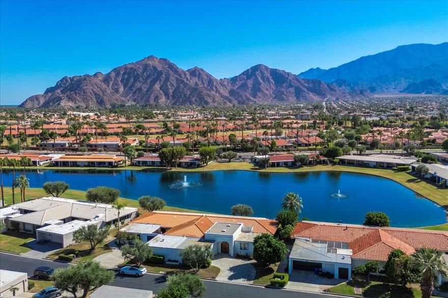 Elegant Lakefront Living in Prestigious Lago La QuintaSituated in the prestigious gated community of Lago La Quinta, this stunning 3-bedroom, 3-bathroom lakefront home offers 2,750 square feet of refined desert living with panoramic views of the Santa Rosa Mountains. Thoughtfully designed with both comfort and style in mind, the open-concept layout flows seamlessly from the spacious living area into the dining room and kitchen, creating the perfect setting for both entertaining and everyday relaxation.From the moment you step through the front door, the stunning lake and mountain views command your attention--a true show-stopper that sets the tone for the rest of the home. Expansive sliding glass doors invite natural light throughout the open-concept floor plan, seamlessly connecting the spacious living room, dining area, and chef-inspired kitchen. Perfect for entertaining or quiet evenings at home, the layout flows with ease and elegance.The gourmet kitchen boasts granite countertops, stainless steel appliances, a breakfast bar, and abundant storage--ideal for both casual dining and hosting. The primary suite offers a peaceful retreat with dual walk-in closets and a luxurious en-suite bathroom featuring dual vanities. Two additional bedrooms provide flexibility, with one thoughtfully transformed into a home theater with a high-definition projector.Outdoors, a covered patio creates the perfect setting for morning coffee or sunset dining, where shimmering lake waters and mountain silhouettes create a breathtaking backdrop. Mature landscaping, hardwood floors, recessed lighting, and fireplace further elevate the property's timeless appeal. Additional highlights include 4 year old sliding doors and A/C units, plus an attached two-car garage.Offering 72 homes as part of the world famous La Quinta Country Club, Lago La Quinta is a quiet, beautifully maintained enclave offering residents access to a scenic private lake, 3 community pools, a sport court with tennis/pickleball/basketball and a peaceful atmosphere. Conveniently located just minutes from world-class golf courses, shopping, dining, and Old Town La Quinta, this property blends luxury, privacy, and a resort-like setting.This rare lakefront opportunity combines timeless architecture with breathtaking surroundings--perfect as a full-time residence, seasonal escape, or investment property.