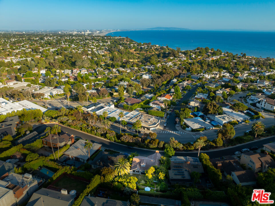 A Rare Survivor. An Exclusive Coastal Sanctuary. Set high on a private, tranquil street, 16655 Marquez Terrace is one of the few residences that stood strong during the recent Pacific Palisades fire. This rare lease opportunity offers an air of exclusivity and peace in a neighborhood where only a handful of homes remain. With expansive windows, calming canyon breezes, and an undeniable aura of serenity, this residence blends luxury with resilience. Imagine evenings on the terrace surrounded by untouched natural beauty. Whether you are seeking a temporary home during your rebuild, or simply desire a private retreat in one of Los Angeles' most sought-after enclaves, this property embodies strength, elegance, and rare opportunity. Perched gracefully on a quiet private cul-de-sac, this Hamptonesque-style estate offers sweeping Pacific Ocean views and a story unlike any other. The home embodies resilience, elegance, and serenity in a neighborhood forever transformed. Step inside to sun-drenched interiors fully furnished in vintage Hollywood Frank Sinatra style, blending classic glamour with timeless coastal sophistication. Every detail has been curated, from elegant furnishings to artful decor, creating a home that feels both historic and completely move-in ready. Alternatively, enjoy the existing charming 4-bed, 3-bath ocean-view home. This ranch-style residence captures breathtaking, panoramic views of the shimmering Pacific Ocean and the lush surrounding landscape. As you step into the main level, you'll be greeted by a vaulted living room and dining area bathed in natural light, creating an inviting and open atmosphere. The quaint kitchen, equipped with sleek stainless steel appliances, offers a modern and functional space for culinary adventures. Three bright and airy bedrooms, including the primary suite, are located on this level. The primary bedroom features serene views of the oversized grassy terraced yard, a perfect spot for morning coffee or evening relaxation. The additional two bedrooms, along with the living room, offer stunning ocean views that will leave you mesmerized. The attic has been creatively converted into two bonus rooms and a full bathroom, adding versatile space for a home office, playroom, or guest suite. On the lower level, you'll find a large bedroom with an en-suite bath and its own private entrance providing privacy and ease for guests or extended family. Step outside to your private backyard oasis, featuring lush landscaping and a hot tub under the stars, perfect for unwinding, entertaining, or escaping from the world in total privacy. Luxury Turnkey Living Fully Furnished Vintage Hollywood Glam. Elevated above the street for sweeping Pacific vistas. Private Backyard Retreat . Lush landscaping and hot tub for complete escapism. Rare privacy in a serene neighborhood. All Utilities Included: Electricity, water, gas, WiFi, and alarm system. Additional Services Available- Housekeeping can be arranged upon request. Includes all towels, linens, kitchenware, and essentials simply bring yourself. Prime Location Near Brentwood & Santa Monica. Nestled in the Pacific Palisades, not far from Brentwood and Santa Monica, residents enjoy world-class dining, upscale shopping, beaches, cultural institutions like the Getty Center and Broad Stage, and scenic coastal recreation all while maintaining the privacy and exclusivity of the Palisades. A Community Reawakens The Palisades neighborhood is revitalizing, with beloved establishments returning: Spruzzo Palisades has reopened in the Highlands, bringing back its iconic charm.Other local favorites including Palisades Garden Caf, Moku Sushi, Prima Cantina, Caff Delfini, The Golden Bull, MUSE Santa Monica, and Giorgio Baldi are once again serving the community, adding vibrancy and optimism to the area.