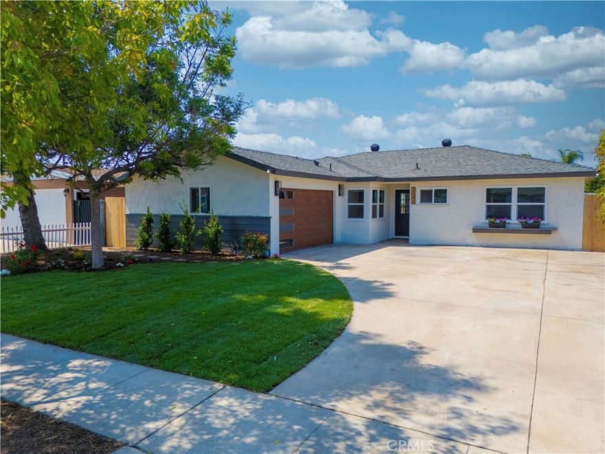 Absolutely gorgeous completely remodeled turnkey 3br 2ba single story home located in the heart of Anaheim.  Spacious living/great room with abundant windows facing the backyard, beautiful kitchen, separate den, primary bedroom, upgraded baths, 2 car attached garage, and large backyard for entertaining.  Quality upgrades include the following:  New composition roof, new dual pane windows, scraped and textured ceilings, fresh interior and exterior painting, new 8mm 9" LVP flooring and 5 1/2" baseboards throughout, white quartz kitchen countertops, matte porcelain subway tile backsplash, new shaker solid wood cabinets, sound damping solid wood accent walls in kitchen, 8W 120V cabinet lighting, new Samsung appliances (5 burner Stainless Steel gas range, microwave, self-circulating kitchen hood and dishwasher), new refrigerator water lilne, Moen disposal & water efficient Delta touchless kitchen sink faucet, new interior and exteror doors, new floor to ceiling closet doors, bathroom walls and floors customized with marble tiles, large format porcelain tiles, porcelain mosaics, 32" vanities,tempered glass shower doors, humidity sensing exhaust fans & Kohler bathroom faucets and shower sets, new 200 AMP electrical panel and a new electrical main service mast, new breaker for all wirings, new switches, outlets and GFCI's, new pendant lights, recessed lighting, ceiling fans with lighting kit, new fully insulated overhead garage door with glass accents, new garage door opener with lighting kit and remote, new epoxy flooring in garage, new Ecobee Smart Home thermostat, newer AC & duct work, new laundry utilities including cold/hot water, drain, gas and ventilation to exterior, new 40 gallon water heater, new automated sprinkler system, timer and drip system, new landscape & hardscape, exterior paint over the retaining walls & pavers, and new cedar wood fencing and gates. Don't miss out!