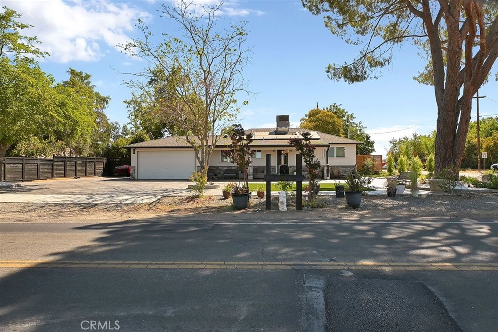 ***EXCELLENT LOCATION*** Updated Home on Nearly Half an Acre Corner Lot! Welcome to this beautifully updated property, perfectly situated on a spacious corner lot of almost half an acre. With a two-car garage and plenty of outdoor space, this home offers both convenience and versatility. The property has seen numerous upgrades in the last three years, including fresh stucco in the front, new cement work, and a roof that’s just over a year old. Inside and out, this home has been thoughtfully refreshed, making it move-in ready. Out back, enjoy a large covered patio—perfect for family gatherings, entertaining, or simply relaxing outdoors. Multiple sheds provide plenty of storage for tools, toys, or hobbies. There’s also ample land for a vegetable garden, fruit trees, or even chickens, giving you the chance to enjoy your own backyard homestead. Don’t miss your chance to see all that this updated property has to offer—schedule a showing today!