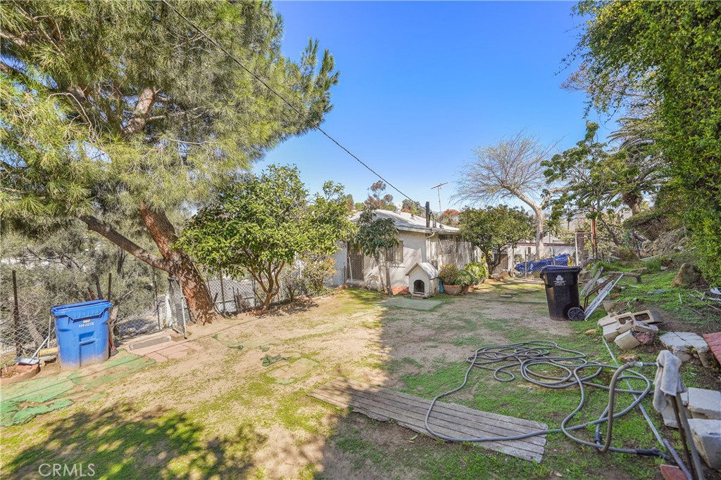 Nestled in the heart of Echo Park, this 2-bedroom, 1-bath fixer-upper presents an incredible opportunity to renovate, expand, or build new in a prime Los Angeles location. The main house (1,086 SF per assessor) sits on a generous 50x150 ft lot and features a raised foundation, a lower-level recreation room, and an additional workshop space with plumbing access. A separate 396 SF playroom (built in 1938) adds versatility, ideal for an office, studio, or guest retreat. This property also includes a second parcel (APN: 5422-021-005) designated for an irrevocable easement and right of way, enhancing accessibility. Additionally, a leveled parking pad provides extra parking space, a valuable feature in this high-demand neighborhood. Whether you're an investor, developer, or buyer with a vision, the possibilities are endless—remodel, expand, or create a brand-new masterpiece. Located just minutes from Elysian Park, vibrant cafes, and DTLA, this is a rare find in one of LA’s most desirable neighborhoods. Don’t miss this incredible opportunity!