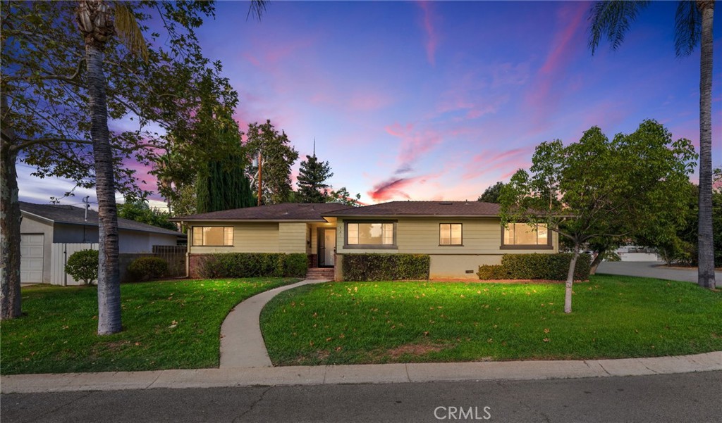 Classic South Redlands single story ranch with a private yard and detached two car garage on a quiet street with no HOA. With less than 30 homes total, the Lemon-Lime streets are a classic example of quaint 1950's Redlands charm. They're conveniently located just off of Cypress, which means excellent proximity to I-10, downtown Redlands, grocery shopping, Starbucks, and Redlands High School. This particular home is a turnkey example sitting on a sizable corner lot. Enter into a living room with a fireplace that creates two separate sitting areas. One of those is the corner, with large windows on two walls. The other is just off the french doors leading into the private backyard. The kitchen has eat in dining, and can also be accessed via the private patio. A spacious full bathroom that retains much of it's vintage charm services the two bedrooms on the south side of the home, and a third bedroom is serviced by a second bathroom with a walk in shower. The yard features both a concrete sitting area, and a private back section with a lawn and mature growth. A detached two car garage features hookups for the washer and dryer. All appliances are included! Excellent Redlands Schools.
