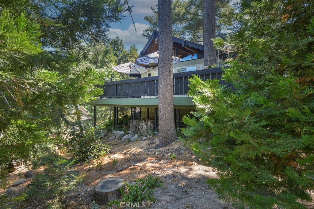 Rare One-Level Retreat in the Pines
Tucked away at the end of a quiet dead-end road, this custom-built gem offers the perfect blend of privacy and charm. Situated on a generous quarter-acre lot surrounded by majestic pine trees, this rare single-level home features 2 bedrooms, 2 baths, and an open layout designed for both comfort and style.
Enjoy the warmth of natural light streaming through full-wall windows, or step out onto the expansive deck—ideal for entertaining or relaxing among the trees. Thoughtfully designed with high-quality finishes and a seamless indoor-outdoor connection, this home is a peaceful sanctuary with a timeless mountain-modern feel.
A true find for those seeking serenity, space, and single-level living in a stunning natural setting.