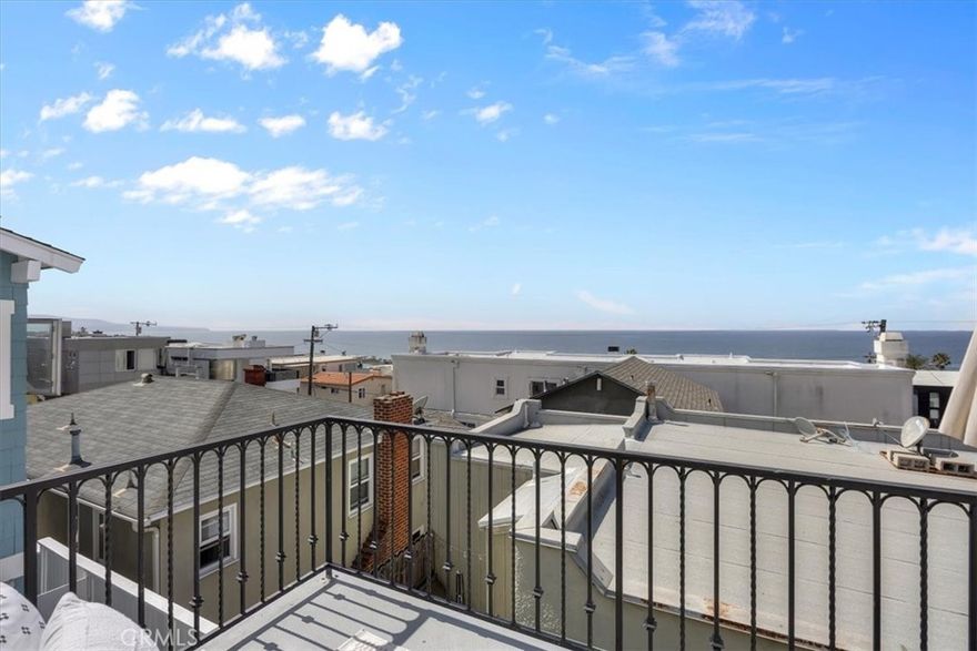 Welcome to 228 5th Place! This home truly offers it all—an A+++ South Sand Section location paired with panoramic ocean views that span from Malibu to Palos Verdes. With three ensuite bedrooms, it strikes the ideal balance of comfort, style, and effortless coastal living.  Positioned just below Highland, the location is truly the “sweet spot” of Manhattan Beach—only steps from the sand and moments from downtown’s vibrant energy, yet with a setting that feels private and serene.  Inside, the home feels fresh and inviting. Satin-finished walnut floors highlight their natural grain, custom window coverings frame the views, and the interiors are filled with light, creating a contemporary yet welcoming atmosphere. At the heart of the home, the kitchen stands out with its striking butcher block island, Viking range, paneled KitchenAid refrigerator, lacquer-finished cabinetry, and polished marble and limestone surfaces—equally suited to everyday living and entertaining.The classic Spanish-style exterior has been beautifully maintained and showcases timeless architectural details, from terra cotta entry stairs and wrought-iron railings to arched windows, a turret feature, and a traditional tile roof—all enhanced by a sophisticated color palette.  Move-in ready and thoughtfully appointed, this residence captures the very best of Manhattan Beach living: stunning views, a premier location, and a home that’s as stylish as it is livable.