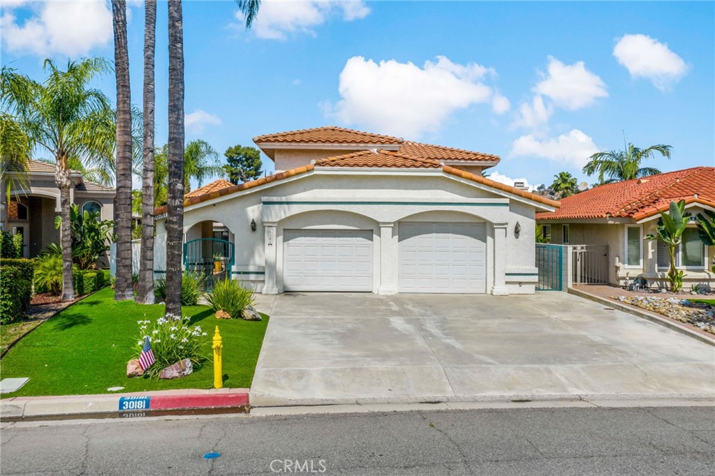 PRICE REDUCED AGAIN on this beautiful home on a quiet canal off the East Bay w private aluminum boat dock and electric lift. Enjoy lake front living in this 4 bed, 3.5 bath, 3100 sq ft home w unmatched custom interior construction features for seismic safety and ZERO fire rating. Elegant touches throughout this welcoming home with 1 bedroom and ensuite full bathroom downstairs with a separate entrance to side yard. Features include an entry foyer w lighted alcove that leads to the living room w walk-in wet bar and adjacent family room, both served w a dual facing fireplace AND direct access thru sliding glass doors to the back patio w lake views. The kitchen is open the informal dining area with a vaulted ceiling and circular bank of windows offering lovely lake views. The large primary bedroom features a vaulted ceiling w ceiling fan and an extensive balcony w fabulous lake views. The spacious primary bathroom features a large vanity w dual sinks and a separate tub and walk-in shower w heating and seating bench. The two large secondary bedrooms upstairs include oversized closets w built-in shelving and are served by the hall bathroom. The oversized laundry room features a deep sink, plenty of storage space and under cabinet lighting. The large garage has extensive lighting, 2 separate 220 outlets, skylights, built in storage, a second washer & dryer hookup station and a heat pump powered water heater that also serves as a cooling system. RV hookups are in the extended driveway for RV compatibility w 110&220 connects, dump station and cable. Just steps away from the back patio is 70 feet of water frontage that leads to the covered dock w an electric boat lift to conveniently enjoy the lake and boating lifestyle of Canyon Lake. The home has a paid 40 panel solar power system w new inverter for fantastic energy cost savings. HOA amenities include a HUGE clubhouse w restaurant, meeting space, pool & spa, fitness center, plus sports courts, equestrian facilities and multiple parks in addition to the Canyon Lake Golf Course. See this special home today.
