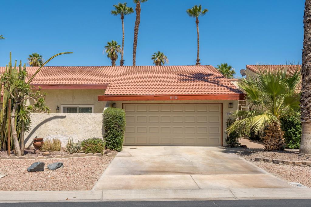 This condo is truly a must see. To add to the light and bright feel, are 4 Solar Tubes throughout condo. Overlooks the golf course. Upon entering, you will notice the beautiful hardwood flooring. Kitchen has granite countertops. Primary ensuite bath includes tile shower with 2 sinks. There are 2 sliders that open up to the back patio. Both front and back patios have been extended with pergolas. This immaculate unit includes a double car garage with a large storage loft and 240 volt outlet for charging cars. Condo interior was painted 2 years ago along with Primary Bedroom carpet being replaced. Garage door was also replaced with an insulated door. Community pool conveniently located down the street. Front door faces West. Pride of ownership shines throughout. Priced to sell!