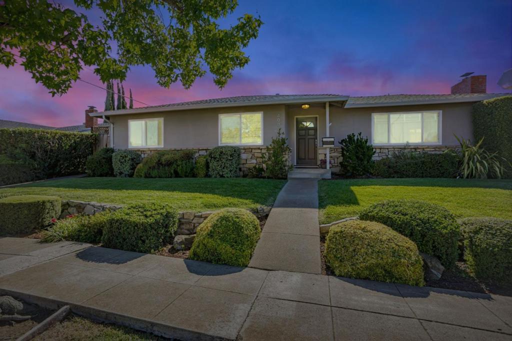 Beautiful home on a large corner lot in the desirable Union School District, offering plenty of space to extend or add an ADU. This 3-bedroom plus bonus room residence features newly remodeled bathrooms and gleaming hardwood floors throughout. The brand-new spa-like primary bath is a serene retreat, while several bedrooms offer new closets. Recent updates include a new roof plus new appliances in the kitchen and laundry for modern convenience. The elegant formal living room boasts custom paint, glass doors, and a cozy fireplace, while the spacious family/dining/kitchen area offers its own custom fireplaceperfect for gatherings. Step outside to a huge backyard with lush grass, a large pergola-covered patio, and beautiful solar-powered night lighting that highlights the gardens. Additional features include a large storage room, extra off-street parking, and abundant space for outdoor entertaining. Located within award-winning Oster Elementary, Dartmouth Middle, and Branham High boundaries. This is truly an awesome place to call home!