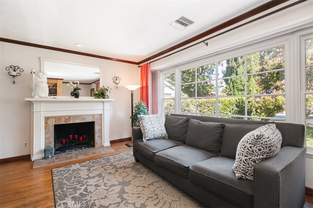 South of Ventura Blvd, in one of Woodland Hills’ most sought-after neighborhoods, sits this charming California home. Built in 1950, it offers 3 spacious bedrooms and 2 baths within 1,428 sq. ft. of comfortable living space. Hardwood floors, crown molding, a cozy fireplace, and stunning picture windows overlooking a lush front yard on a beautiful tree-lined street create a warm, inviting atmosphere.
The dining area and kitchen open to a serene backyard with a covered patio—perfect for morning coffee or evening gatherings. The expansive primary suite features high ceilings, French doors to a private sitting area, and a luxurious bath with a Jacuzzi tub and separate shower. The middle bedroom, currently an office, is accented by rich hardwood pocket doors, while the front bedroom boasts mirrored closets and recessed lighting.
A generous 2-car garage offers potential for an ADU or expanded living space. This is a home you’ll want to see in person—classic charm in a prime location!