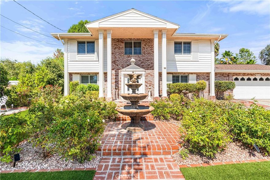 Energy-saving and entertaining are effortless in this spectacular 5 bed, 2.5 bath two-story colonial-style home, tucked away on a quiet cul-de-sac west of Valley Circle in Woodland Hills. Set on a nearly 11,000 sq. ft. flat lot, the private backyard is an entertainer’s dream with a swimmer’s pool, spa, fire pit, putting green, mini basketball court, and an outdoor kitchen complete with dual BBQs, gas range, beverage fridge, sink, and granite counters. Inside, hardwood and tile floors flow throughout. All five bedrooms are upstairs, including a spacious primary suite with dual sinks and walk-in shower. The upgraded kitchen with island, granite counters, and double ovens opens seamlessly to the dining and family rooms, while sliding French doors connect to the backyard. The living room features crown molding and a marble fireplace for timeless charm. Solar panels help cut costs while powering central HVAC and an EV charging station. Additionally, there is a water submeter to separate irrigation water usage from house water usage, this saves money on the DWP bill. A sprinkler drip system saves water, too! Close to award-winning schools—Lockhurst Elementary, Hale Charter Academy, and El Camino Real Charter High—plus easy access to Hwy 101, The Commons at Calabasas, Topanga Village, and Ventura Blvd dining and shops. Available unfurnished for $8,000/month or furnished for $9,500/month. One-year lease desired. This Woodland Hills gem offers modern amenities, classic style, and a lifestyle of comfort and convenience. Inquire today!