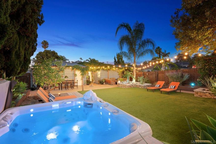 Discover this storybook 1940s Traditional Cottage nestled on one of Rolando Village’s most beloved tree-lined streets. Filled with warmth and character, this single-level home blends vintage charm with modern comfort, featuring coved ceilings, smooth plaster walls, central A/C, and full smart-home integration. The living room flows to a den or dining space, with French doors opening to a private backyard retreat complete with saltwater spa, fire pit, and custom Hue lighting. Meticulously upgraded with seismic strapping, 200-amp panel, and foundation work, this flat corner lot with two-car garage is zoned RS-1-7 and offers ADU potential. A rare find in a truly vibrant community.  This Storybook 1940s Traditional Cottage captures the essence of classic San Diego living, where period charm meets modern innovation. Inside, arched coved ceilings, smooth plaster walls, and French doors reflect its historic craftsmanship, while smart-home upgrades including Ecobee HVAC, Hue lighting, Abode security, and Wi-Fi-controlled fans and fixtures add effortless modern comfort. Behind the beauty, the home has been structurally enhanced with seismic strapping, foundation leveling, new attic insulation, and a 200-amp electrical panel. The kitchen offers updated appliances, a walk-in pantry, and flows into a flexible den or dining space. Thoughtful touches include a built-in Murphy bed, new hardware, and central air conditioning. The backyard is a true oasis, featuring high-end turf, stacked-stone planter beds, palm trees, and a saltwater spa, all framed by custom Hue lighting that shifts from soft evening glow to vibrant celebration hues. Even the fencing, garage windows, and exterior concrete have been renewed, while a greenhouse adds a sustainable touch.  The flat corner lot with a two-car garage (accessed from Solita Ave) is zoned RS-1-7, allowing one ADU and one Junior ADU, with potential for up to four ADUs under the city’s density bonus program could be ideal for expansion, multi-generational living, or added income.  Located in the heart of Rolando Village, minutes from SDSU, Downtown, and the beaches, this home blends timeless character, thoughtful upgrades, and the vibrant spirit of San Diego living.