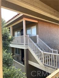 Fantastic upper level corner location offers warm natural light, wood like laminate flooring, upgraded kitchen and dining area with ceiling fan, large living room with Ac unit and cozy master bedroom and bathroom. This property is near college, freeways, shopping, public transportation, parks, hospitals and includes a 1 car garage a community parking spot. This home is gated entry only and offers a community pool. Water and trash included.