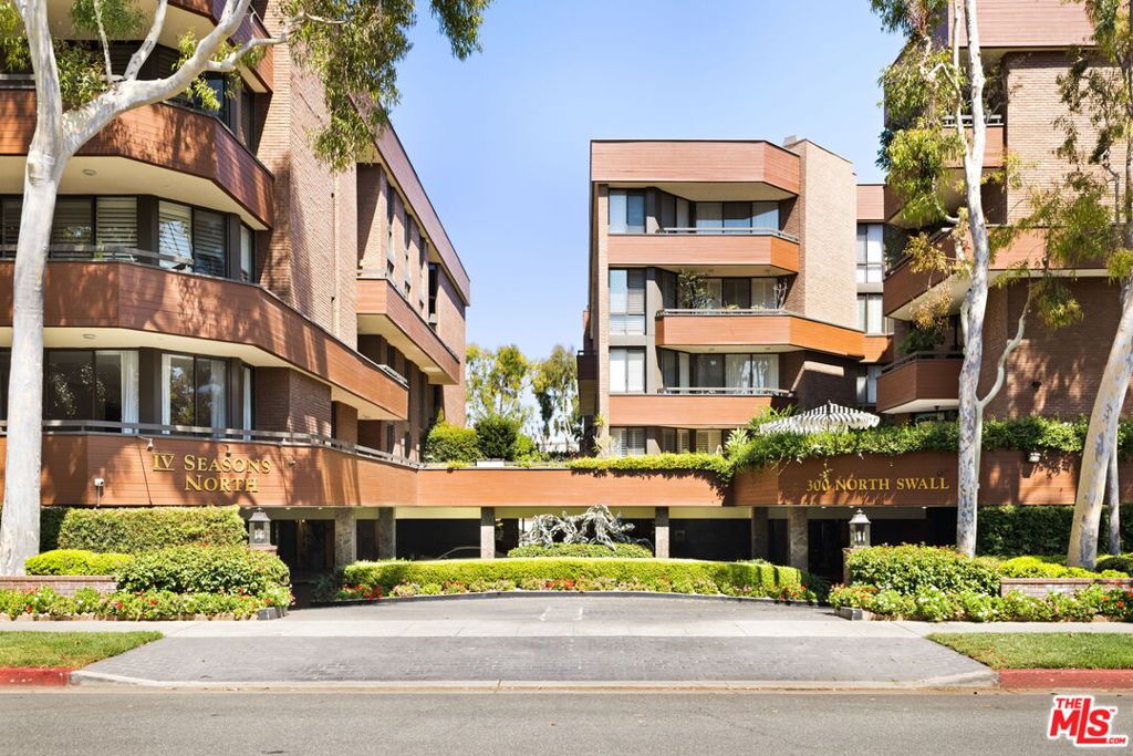 Welcome to 300 N Swall Dr, Unit 353 a light-filled, desirable east-facing residence located in the coveted Four Seasons Condominiums of Beverly Hills. This elegant 2-bedroom, 2.5-bathroom condo with a den offers a spacious and thoughtfully designed layout, ideal for both entertaining and everyday living. Set in one of the city's most prestigious full-service buildings, this home delivers luxury, comfort, and convenience at every turn.Step into a grand black marble entryway that sets the tone for the refined interiors throughout. The expansive living room features a cozy fireplace, floor to ceiling windows, recessed lighting, crown moldings, and custom built-ins. The flow continues seamlessly to a generous balcony with treetop and city views, a formal dining area, and a den/TV room complete with a built-in bar perfect for entertaining. The kitchen is equally impressive, offering abundant storage, dual pantries, and a charming breakfast nook. Down the hall, a massive hallway closet with built-in shelving, coat closet, and an in unit laundry room offers exceptional convenience.The oversized primary suite is a private retreat with two large walk-in closets plus two additional mirrored closets one with built-in shelving. The spa-like bathroom showcases Calacatta marble countertops, dual sinks, vanity areas, a walk-in shower, an extended-length soaking tub surrounded by matching marble backsplash, and generous built-in storage. The second bedroom offers its own en-suite bath, while a powder room completes the home.Throughout the unit, plantation shutters and custom finishes enhance the classic elegance of the space. Residents of the Four Seasons enjoy access to premier building amenities including 24-hour doorman service, full-time concierge, valet parking, pool, spa, fitness center, and extra storage.All of this is set in a prime Beverly Hills location moments from world-class shopping and dining. Enjoy the ultimate in luxury living with the privacy, space, and service rarely found in condo living. A rare opportunity in one of Beverly Hills' most desirable full-service buildings.