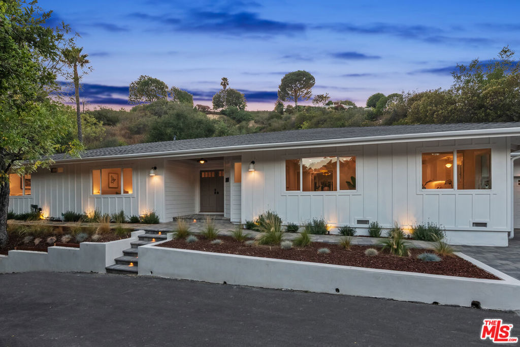 Privacy South of the Boulevard! This elegantly remodeled 4-bedroom traditional home sits on a private road, blending timeless style with modern refinement. An open yet defined layout includes a spacious living room, separate family room, formal dining room, all dressed in white oak hardwood floors and walls of glass providing a sense of freshness and abundance of natural light. The chef's kitchen features Carrara marble counters with handcrafted Moroccan tile backsplash that seamlessly connect to the dining and family room. A spacious primary suite offers a walk-in closet and a spa-style bath leading to the spacious private backyard. Ideally located within minutes of Ventura Blvd and in close proximoty to Westwood, Century City, and LAX.