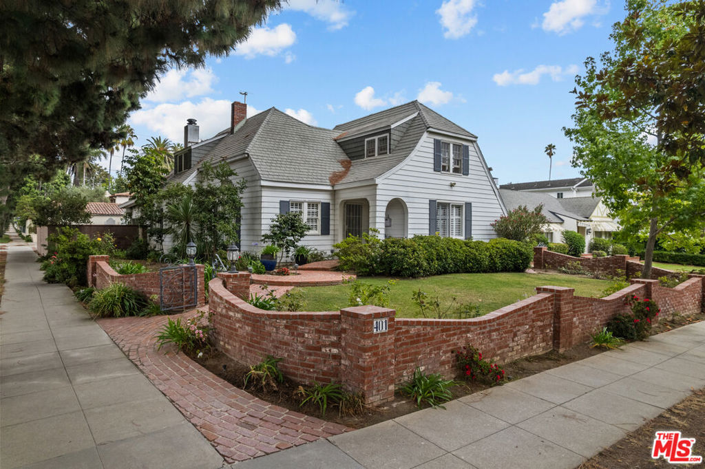 Charming Cape Cod home on a spectacular 8,900 sqft corner lot in Santa Monica's most coveted north of Montana location. The home features 4 bedrooms and 2 bathrooms and has unlimited potential. As you enter, you are greeted by the incredible large living room with high vaulted ceilings, a grand fireplace and lots of natural light. The formal dining room is perfectly located just off the remodeled kitchen that features quartz counters and a center island. Wonderful family room with a built in bar and a fireplace and leads out the covered patio and spacious back yard, perfect for entertaining or el-fresco dining. There is one bedroom on the lower lever with a remodeled bathroom and the upper level has 3 additional bedrooms. The home has over 2100 sf and an existing detached 300 sqft (approx) art studio with kitchenette and so many possibilities. The back yard is very spacious and features a an area with built in bench seating surrounding a fire pit. There is also a detached 2 car garage, with a loft and tons of extra storage. Close to trendy stores, restaurants and grocery stores on world famous Montana Ave, just 17 blocks from Ocean Avenue and the beach. This home is located in Santa Monica's highly sought after school district.