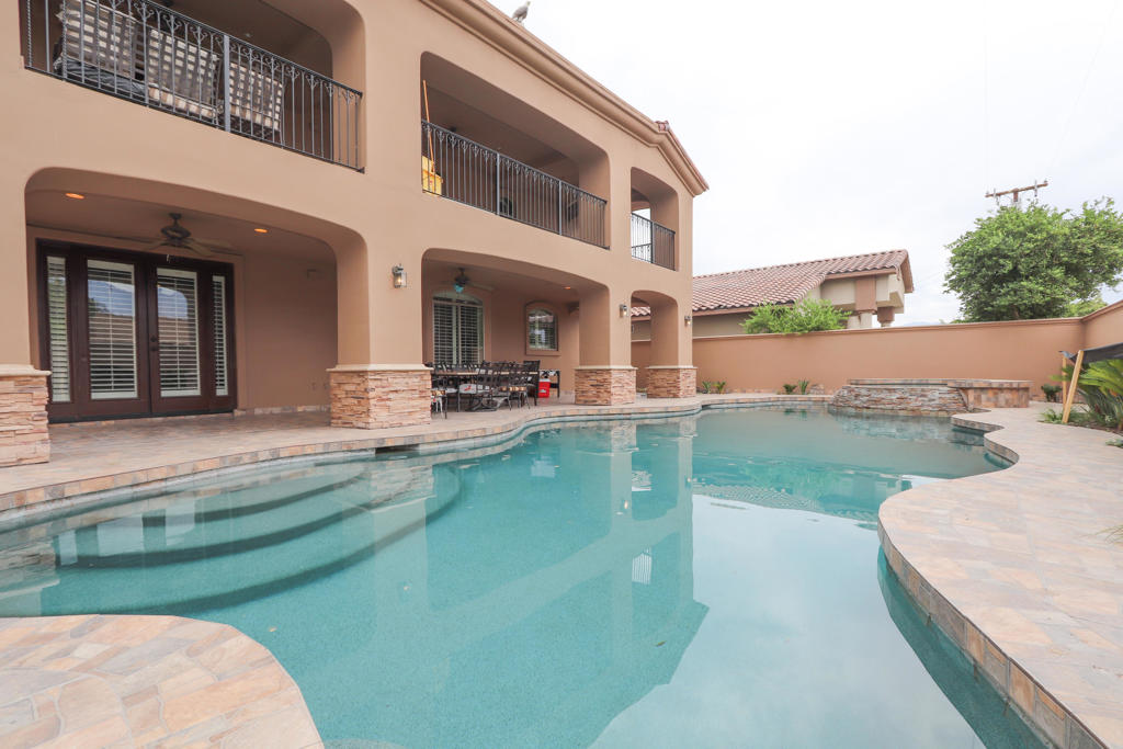 Builder's pride, jumbo sized home (3,753 square feet) featuring 6 bedrooms and 5 bathrooms 3 fireplaces, with well over a million dollars invested in this estate. Beautiful stone work throughout including Travertine flooring, gourmet kitchen with granite counters, 2 story home with 2 balconies, 2 fireplaces, spacious pool and stacked stone spa, covered patio, and solar system. Tons of detail and upgrades in this one. Situated in a desirable area of Cathedral City. Panoramic mountain views, and one of the nicest homes you'll see in Cathedral City. No HOA dues. Furniture negotiable.