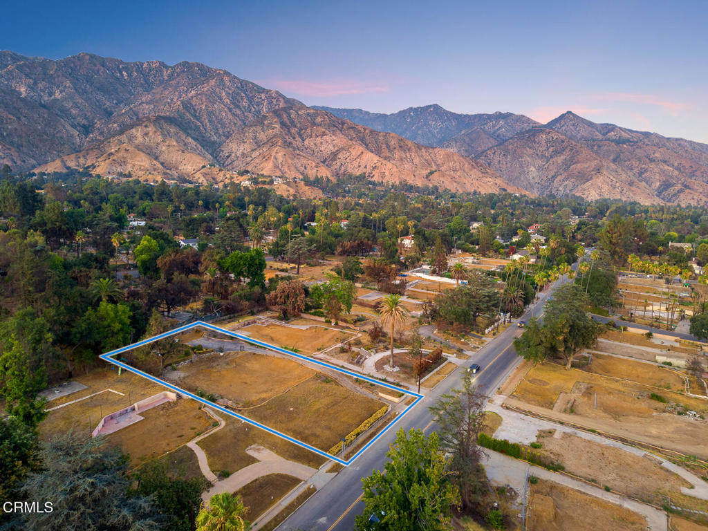 This is an exceptional opportunity to own a large, beautiful lot in the desirable country club area of Altadena. Sitting above the street, the half-acre property boasts views of the majestic San Gabriel mountains to the north and twinkling city lights to the south. A large palm tree in the northwest corner of the property survived the Eaton fire. Phase II debris removal has been completed. The rectangular lot measures 22,600 square feet (100 ft wide X 226 ft deep per the assessor's map). The original architectural plans for the stunning 1923 Italian Revival home that graced the property are available, as well as recent add-on designs from House of Honey in South Pasadena. Public records reflect that the 3-bedroom, 3.5-bathroom house was 3,286 square feet. A long driveway to the site of the former garage and guest house remains. The property is being sold in its current as-is condition. This is your chance to build on a magical piece of land in beautiful Altadena!