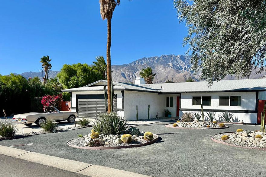 Experience luxury desert living at its finest with this fully updated and stylish 3-bedroom, 2-bathroom home offering a resort-style backyard and beautiful mountain views. Situated on a generous corner lot, this immaculate property is perfect for both entertaining and relaxing in true Palm Springs style.From the moment you enter, modern design and comfort greet you. Updated windows and doors fill the home with natural light while showcasing the gleaming tile flooring, designer color palettes, and surrounding mountain scenery. The flexible layout includes a spacious living area and a secondary sitting area ideal for lounging or reading.The open kitchen features light wood cabinetry, a full suite of stainless-steel appliances, a sleek tile backsplash, and a dining counter with a waterfall edge. Adjacent to the kitchen is a welcoming space with a fireplace currently serving as the dining area, which is ideal for gatherings and conversation. From here, sliding glass doors connect the interior to a private resort-inspired backyard complete with a sparkling pool, raised spa, and multiple seating areas. Several lounging zones feature low-maintenance artificial turf and there is a cozy gas firepit for evening enjoyment. A stylish dining pergola with bistro string lighting adds a touch of romance to outdoor entertaining.The primary suite opens directly to the backyard and offers a tranquil retreat with mountain views, ample closet space, and a beautifully updated en-suite bathroom. Two additional bedrooms are located at the front of the home with bright eastern exposure, accompanied by a designer hall bath featuring modern tile and fixtures.Additionally, there is an attached two-car garage with stacked laundry. The side yard provides RV parking in case your Airstream needs a home. For buyers seeking economic flexibility, this property qualifies for a junior rental permit through the City of Palm Springs, allowing up to six short-term rentals annually and unlimited stays of 30 days or longer--making it a perfect option for those wishing to offset living expenses with rental income.
