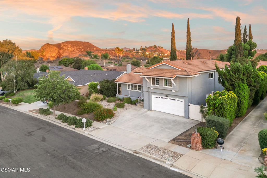 Tucked away in the sought-after Sunset Hills neighborhood of Thousand Oaks, this versatile 4-bedroom, 3 bath home captures the essence of California living with beautiful sunrise and sunset views.A welcoming entry opens to light-filled spaces with an easy flow between the living room, dining room, and kitchen. The living and dining areas are anchored by a cozy fireplace, perfect for gatherings with family and friends. The kitchen offers granite counters, stainless steel appliances, and an inviting breakfast room. A separate family room on the lower level, along with a convenient powder room, provides another comfortable space to relax, work, or entertain.Upstairs, the primary suite includes its own ensuite bath, while a secondary bath serves the three additional bedrooms. Plantation shutters, generous closet space, and a newer heating and air system add comfort and peace of mind.The backyard is designed for true indoor-outdoor living, with a large deck, grassy lawn, and plenty of room to create your dream oasis--including the possibility of adding a pool. Whether hosting a summer barbecue or enjoying a quiet evening under the stars, this private setting delivers.Ideally located near Sunset Hills Golf Course, award-winning schools, scenic trails, parks, shopping, and dining, this home offers the perfect balance of lifestyle, convenience, and charm.