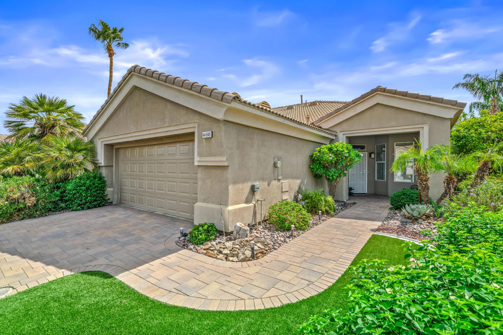 Great 2 bedroom 2 bath home located on the 13th fairway in Heritage Palms C.C. This TURNKEY FURNISHED home features a beautiful brick paver driveway and walkway to your covered front entrance, artificial turf and desert landscaping. Additional upgrades include granite kitchen counters with stainless appliances, a nook window for an additional eating area, Plantation shutters, lots of storage cabs in the laundry room and a cozy fireplace in the family room for those cool desert winter nights as well. The primary bedroom has a bay window, nice sized walk-in closet, granite counters, a large shower and convenient sliding door to your east facing covered rear patio looking out onto the beautiful fairway. Heritage Palms is a premier adult community featuring an 18 hole championship golf course, indoor and outdoor pools, pickleball and tennis courts, fitness center, grillroom, card rooms, billiards room, social clubs and more.