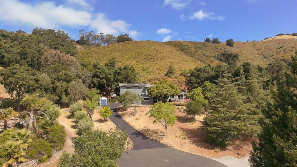 Tranquility awaits you with this 2.5 acre oasis on a private lane in the sought after Morgan Hill area of Paradise Valley. Rarely does this type of property come on the market, a quiet tree lined street just on the outskirts of town, but feeling miles away from it all. This is the proverbial house on the hill, nestled at the end of a cul de sac with no neighbors on three sides of the property. Enjoy the privacy of living at the end of the lane, with outstanding views of the neighboring valleys and mountains. The home boasts three spacious ground floor bedrooms, with a primary suite and adjacent retreat/loft area complete with its own fireplace and built in office center upstairs. To add to the beauty and functionality of the home, there is another full bath and a bonus half bath on the lower floor, as well as a spacious laundry room. Updates abound in the home, including new roof, paint, siding and electrical. Don't pass up this opportunity to own a little slice of paradise. Located in an area of $3+ million properties. See disclosures for the numerous upgrades to this home.