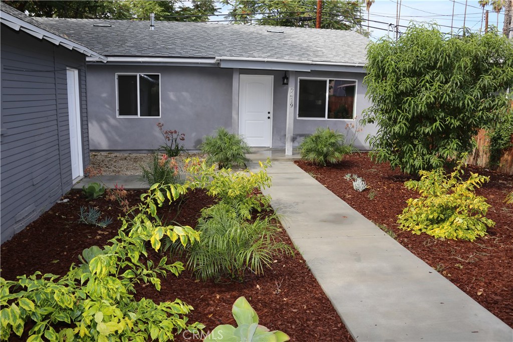 Beautiful, modern home, featuring 3 bedrooms / 2 bathrooms and 1,200 sq. ft. of living space! One of two single family houses sharing a lot, set in the back of a large property. Separate street address. Quiet, residential street. Fully fenced in for privacy. Large, private, beautifully landscaped front yard with drought friendly plants. Large private back yard with concrete pad for a BBQ. Central heat & air, laminate and tile flooring throughout, energy efficient double pane windows. Open floor plan with bright and spacious kitchen and living room. Kitchen offers quartz countertops, modern stainless steel appliances and fixtures, generous storage, and washer/dryer hook ups. Recessed lighting in kitchen and living areas. En-suite private bathroom in the Primary bedroom. All bedrooms offer ample closet space. 2 parking spots available in the long covered driveway for exclusive use. Detached garage has been converted into spacious storage. Conveniently located near The Village, Warner Center, Topanga Mall, and an abundance of great restaurants, shopping and entertainment. Orange Line and Elementary Charter School are within walking distance. Fabulous home with lots to offer and in a fantastic location!