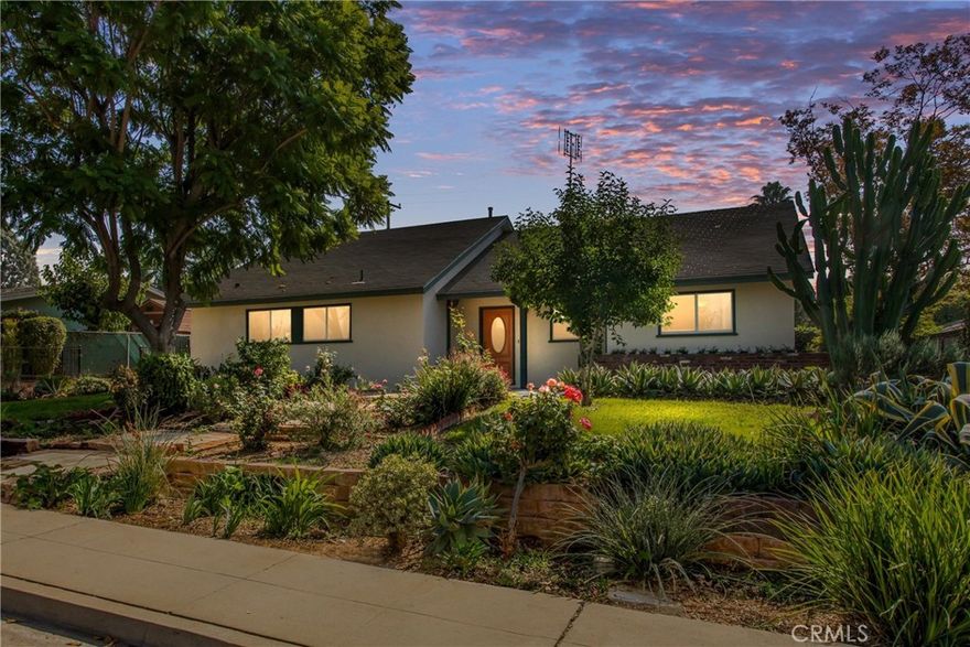 Welcome to 2838 Shenandoah Rd, a charming mid-century pool home tucked in the highly sought-after Cowboy Streets neighborhood of Riverside. Set on a peaceful, tree-lined street with award-winning schools nearby, this single-story residence offers timeless character, modern comfort, and an inviting layout designed for easy indoor-outdoor living. Step through the storybook front yard, where mature landscaping, fruit trees, and succulents frame a brick-lined path leading to the covered entry. Inside, the spacious living room welcomes you with warm natural light, a classic brick fireplace, and large sliding doors that open to the backyard. The adjoining dining nook flows into a bright, oversized kitchen featuring custom cabinetry, abundant storage, vintage tile backsplash, and stainless-steel appliances. A convenient indoor laundry area sits just off the kitchen.  Down the hall, two generous bedrooms share a full vintage-style bath, while the private primary suite offers its own en-suite bath and peaceful views of the backyard greenery. Ceiling fans, dual-pane windows, and thoughtful design details enhance the home’s comfort year-round. Step outside to your own backyard retreat, complete with a sparkling pool and spa, raised garden beds, and lush mature landscaping that provides both beauty and privacy. The extended driveway and detached garage offer ample parking and flexibility for cars, toys, or workshop space. All this in a prime location near Victoria Elementary, Gage Middle, and Poly High, with easy access to the 91 Freeway, CBU, RCC, UCR, and Riverside’s thriving cultural scene downtown. A true blend of Riverside charm, convenience, and comfort — ready to welcome you home.