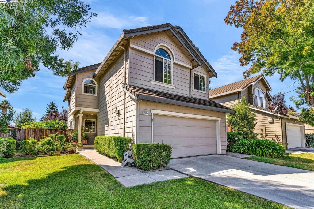 Tucked into a serene, tree-lined street, this charming 3-bedroom, 2.5-bath contemporary gem invites you to experience comfort, connection, and California lifestyle at its best. Inside, you’ll be greeted by soaring vaulted ceilings and expansive windows that flood the open-concept living area with natural light. Whether cozying up near the wood-burning fireplace or hosting friends in the open living/dining space, you’ll love how this layout lives. The spacious primary suite offers true retreat vibes—with high ceilings, a generous walk-in closet, and an ensuite bath with dual vanities. Additional bedrooms are perfect for family, guests, or remote work. Step outside to your private backyard oasis: a covered patio, garden beds bursting with blooms, a fenced dog run, and lush landscaping that attracts hummingbirds, butterflies, and peace of mind. Can you feel the Zen? Modern touches like luxury vinyl plank flooring, smart home features, and ceiling fans make this home move-in ready, while the central location close to shopping, highways, and top-rated schools makes life easy. And with NO HOA, you can truly make this home your own.