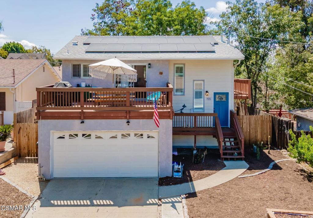 Charming Two-Story with Views, Decks & Versatile Living Spaces! Welcome to 155 Maple Rd, a warm and inviting home nestled in the heart of Newbury Park with hillside views, updated charm, and flexible living. This thoughtfully designed two-story features 3 spacious bedrooms, 2 baths, and generous indoor-outdoor flow from multiple decks and patios. The upstairs living space is light and bright, featuring a remodeled kitchen with custom tile backsplash, shaker cabinetry, and a farmhouse sink. A dining area opens to a large front deck, ideal for al fresco dining or lounging under the stars. The upper-level bedroom includes its own slider to a peaceful side deck and full bath. Downstairs you'll find two more bedrooms, one with direct access to the backyard patio, perfect for guests or a home office. The other includes an oversized closet and slider to a private yard oasis. A second full bath completes the lower level. The layout is ideal for split-level living, guest quarters, or potential JADU (buyer to verify). Enjoy the benefits of owned solar, battery backup, low-maintenance turf, and a spiral staircase connecting both outdoor levels. Set on a quiet street with easy access to trails, shopping, and top-rated schools, this home offers comfort, flexibility, and style in one beautiful package.
