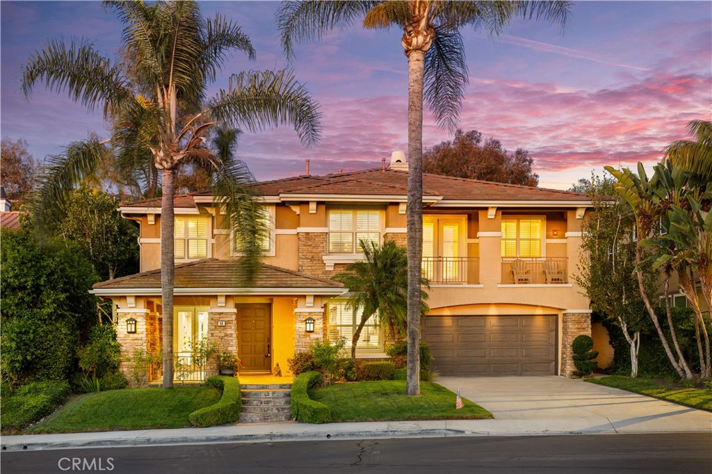 This beautifully upgraded 5-bedroom, 4-bathroom residence is nestled at the end of a quiet cul-de-sac in one of Rancho Santa Margarita’s most sought-after neighborhoods. Boasting a sparkling pool, paid-off solar, spacious loft, dedicated office, and resort-style backyard, this home offers the perfect blend of luxury, comfort, and functionality.
The main level showcases rich hardwood flooring, a dramatic curved staircase, elegant formal living and dining rooms with designer finishes, and a full bedroom with adjoining bathroom—ideal for guests or multi-generational living. The chef’s kitchen is equipped with granite countertops, a large center island, stainless steel appliances, and abundant cabinetry, seamlessly connecting to the expansive family room with a slate-accented fireplace and custom built-ins.
Upstairs, you'll find a generous loft, 3 secondary bedrooms, a built-in office with granite countertops, and a luxurious primary suite featuring a private balcony, stone accent wall, oversized walk-in closet, and a spa-inspired bathroom with marble flooring, dual vanities, and a frameless glass shower.
Designed for entertaining, the backyard features a covered California Room, built-in BBQ island with Blaze grill, granite counters, refrigerator, fire pit with built-in seating, and lush tropical landscaping surrounding the pool.
Additional highlights include paid-off solar panels, plantation shutters, crown molding, recessed lighting, and a 2-car garage with epoxy flooring. Conveniently located near top-rated schools, scenic parks, hiking trails, and RSM Lake.