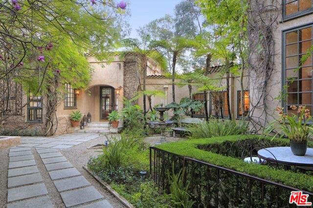Welcome to 1410 Davies, an enchanting, gated estate with celebrity pedigree. Tucked into a quiet, tree-lined hillside, this home exudes California Romantica from the moment you drive through the iron gates and heaven beckons. This outstanding home has it all including city views; perfect for the celebrity client that needs privacy and proximity to Beverly Hills or a hop over the hill to the studios, all on over three acres in Beverly Hills Post Office.