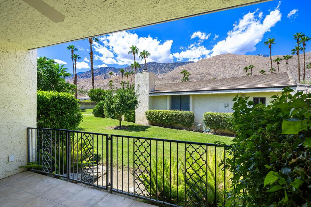 Enjoy a gorgeous West view from this gated patio of this Canyon South II single-level condo in South Palm Springs. (not lease land). This condo has high vaulted ceilings and a spacious floor plan. Each bedroom had a patio area and plenty of closet space. The primary bedroom has a large wall-to-wall closet, plus an additional closet in the bath vanity area. The skylight in the tub/shower/toilet area gives plenty of natural light. Enjoy high ceilings and a nice view. The second bedroom has a walk-in closet and bath with a shower stall, as well as its own patio area. Both bathrooms have been updated. The updated kitchen has access to the one-car garage and laundry area. Additional parking is accessible. Monthly HOA dues include 4 community pools, 2 spas, paid water, trash, outside maintenance (including roof, stucco, and paint), Spectrum Cable & Internet, and earthquake insurance. This community has nice grounds and a pool area. Easy access to hiking, shopping, and restaurants. Make this condo your primary or getaway home.