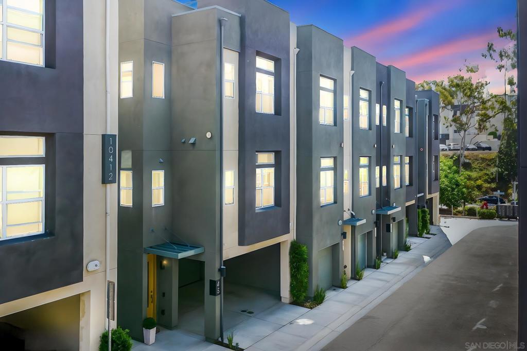 VA approved! Modern Living Near Snapdragon Stadium & SDSU. End-unit Townhome. Welcome to The Harlow—a sleek 2019 ColRich townhome offering modern design, thoughtful upgrades, and a central location. Just minutes from Snapdragon Stadium, SDSU, the trolley line, and the I-8, this home puts you close to beaches, downtown, and more, all within a well-maintained, low-HOA community. This 3-story home features an open floor plan with luxury vinyl plank flooring, quartz counters, stainless steel appliances, recessed lighting, and a center island with bar seating. A laundry closet with a full-size washer/dryer adds convenience, and a remote-controlled shade on the main floor enhances comfort. Upstairs, the primary suite includes a walk-in closet and upgraded en suite bath. Notable upgrades include custom paint, upgraded carpet upstairs, four ceiling fans, and a ceiling-mounted storage rack in the garage. Enjoy outdoor living with a private backyard featuring pavers, river rock, and low-maintenance turf. Parking includes a 2-car attached garage, plus a 2-car carport—parking for 4 total. If you’re seeking low-maintenance style in a prime San Diego location, this one checks all the boxes.