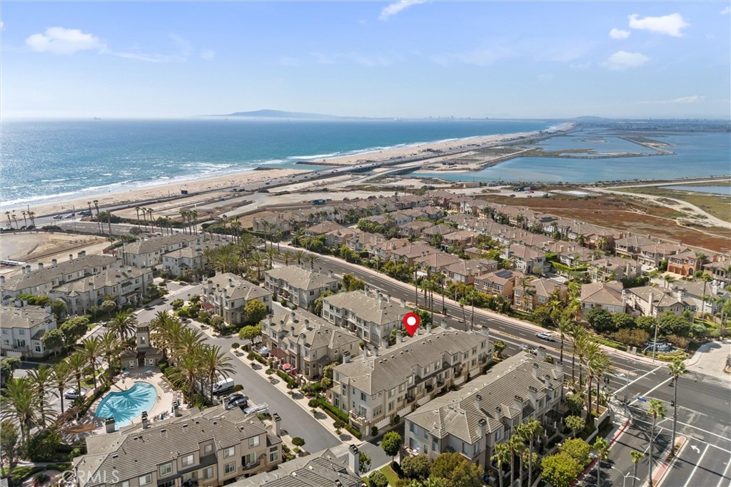 Welcome to this lovingly cared-for and exceptionally spacious 2-bedroom, 2.5-bathroom home with 2,030 square feet of living space, located in the meticulously maintained Surfcrest community of Huntington Beach. This gated enclave offers the best of coastal living, complete with a resort-style swimming pool and spa, beautifully landscaped grounds, and the peace of mind that comes with a secure, private neighborhood.
Inside, the home’s expansive layout offers both comfort and versatility—perfect for entertaining, working from home, or simply unwinding after a day at the beach. The soaring ceilings and wall of windows with plantation shutters flood the living areas with natural light, while a cozy fireplace creates an inviting focal point. The spacious dining room flows seamlessly into the kitchen, which features upgraded appliances, granite countertops, and plenty of storage.
Heading upstairs, a bright and open landing with oversized windows makes for an ideal home office or reading nook. The primary suite is a true retreat, complete with its own fireplace, a stylish sliding barn door leading into two closets (including a spacious walk-in), and a spa-inspired bathroom with a large soaking tub and separate shower. The second bedroom also offers the convenience of an ensuite bath.
On the first level, you’ll find a well-appointed laundry room with abundant storage and an attached garage featuring custom built-ins—a thoughtful touch that maximizes functionality throughout the home.
From this home, you can walk to the beach and soak up the best of coastal living. Spend the day with your pup at Huntington Dog Beach, bike the shoreline path, or enjoy a bonfire at Bolsa Chica State Beach. Nature lovers will appreciate bird-watching at the Bolsa Chica Ecological Reserve and the trails and ocean views at Harriett M. Wieder Regional Park. And when it’s time for dining, shopping, or community events, Downtown Huntington Beach offers it all—from the weekly farmers market and lively Tuesday night street fair to the Huntington Beach Airshow and the US Open of Surfing. Life here is full of options—and all just minutes from your door.
Living at 19271 Surfwave Dr means more than just owning a home—it’s joining a community that embodies the ultimate coastal lifestyle. Want to live everyday like you are on vacation? Then this home is the perfect place for you.