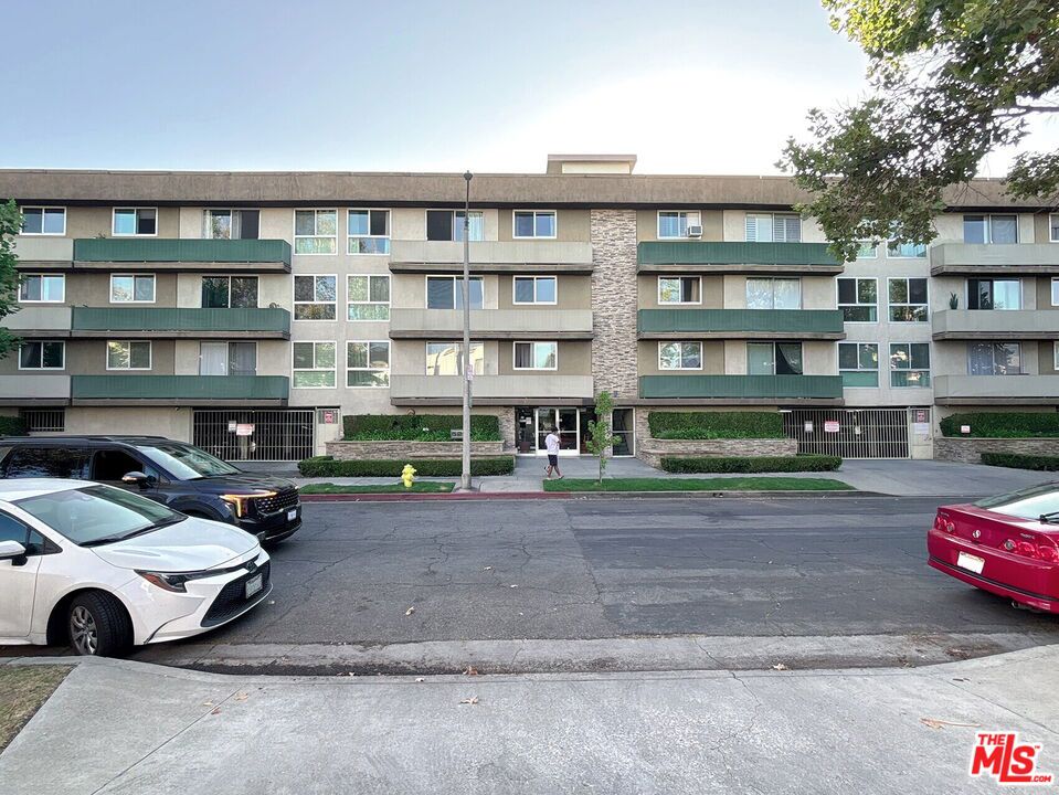 2 + 1 Top-Floor Designer Condo with Hollywood Views in Prime LA Location! Welcome to a designer-done condo located in one of LA's most vibrant neighborhoods! Situated just minutes from the 101 Freeway, The Grove, and Hollywood Sign and La Brea Tar Pits, this top-floor residence blends sleek modern living with unmatched convenience. Nestled on a beautiful tree-lined street known for its architectural charm, this unit offers panoramic views and a cool, contemporary aesthetic.FEATURES: 2 Bedroom + 1 Bathroom. Approximately 813 sq. ft.Top floor unit with sweeping views including the Hollywood Sign and Hills. Spacious den functions as a second bedroom, office, or creative studio.Open concept living space with modern finishes and designer style. Kitchen includes Caesarstone countertops, subway tile backsplash, Carrara marble accents, and bamboo flooring. Stainless steel appliances including dishwasher, electric stove and oven, refrigerator, and microwave.Washer and dryer in unit for added convenience.Energy-efficient windows for year-round comfort. Bedrooms and den feature soft carpeting. Private balcony with expansive views. Gated two car tandem parking on street level with extra storage space. Gas, water, trash, and gardening services are covered by HOA. High Walk Score with fine dining, boutique shopping, and entertainment within blocks.BUILDING AMENITIES: Swimming pool. Sauna. Elevator. Lounge area. RENTAL TERMS: Application fee is $60 per adult. Security deposit is one month's rent on approved credit. However, there are certain exceptions for small landlords who own just two properties, provided that the total rental units between these properties does not exceed four. Landlords who qualify as small property owners may charge up to two months' rent. Lease term is 12 months. Renters insurance is required. No pets allowed. Tenant to pay HOA move in fee of $250. Parking includes gated two car tandem parking.