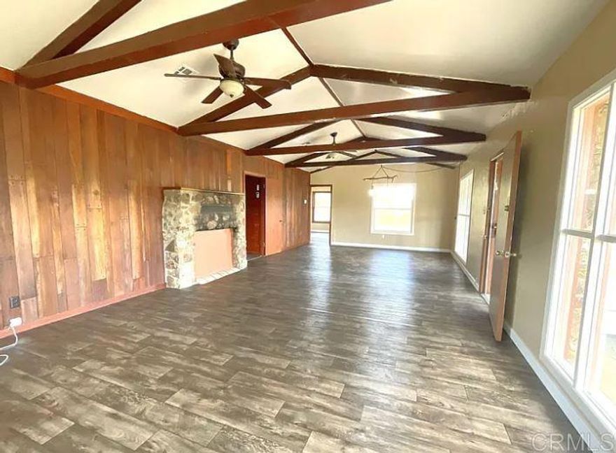 Welcome to an amazing opportunity to own 3 APN's in Alpine. The home currently is a 2 bed, 1 bath with an amazing open combined dining and living space. The kitchen is plenty large making this home great for entertaining. With the potential to split into multiple lots, this property offers the potential for a subdivision development. This property is located in the middle of Alpine adjacent to the Endangered Habitat Conversancy. Views to both the lake behind the mountain and El Capitan Reservoir, this property is prime for a builders vision. APN: 403-011-04-00, 402-210-21-00, 402-210-22-00