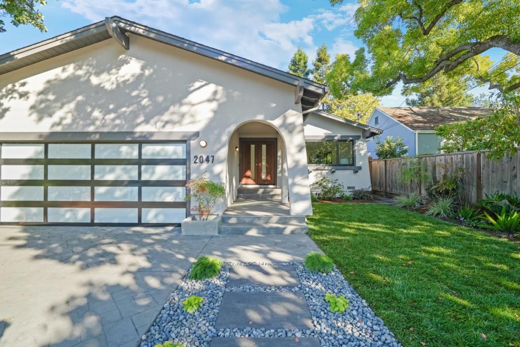 Stunningly remodeled West Menlo Park home has been thoughtfully rebuilt with premium finishes and clean, contemporary design. This single-level home is perfect for indoor-outdoor living. Expansive living/dining room showcases vaulted ceilings, skylights, and abundant natural light. Three bedrooms including the private. primary retreat with sliding doors to the backyard features an en-suite spa-like bathroom with dual sinks, oversized shower, and a walk-in closet. Two additional spacious bedrooms share a hall bath with dual sinks and designer finishes. The chef's kitchen boasts Sub-Zero/Wolf stainless steel appliances, quartz countertops, and white cabinetry, opening to a large family room with fireplace and seamless access to the private yard perfect for entertaining family and friends. Recent top-to-bottom renovation includes hardwood floors throughout, new plumbing, electrical, roof and HVAC with air conditioning. Two-car garage, prime walkable location near shops, restaurants on the Alameda, and top-rated Las Lomitas schools blending style, space, and location to perfection.