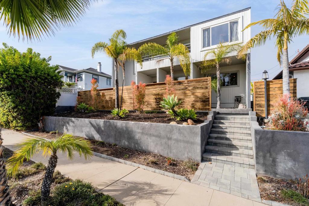 Discover a rare chance to own two residences for the price of one in one of San Diego’s most coveted coastal neighborhoods. This property offers versatility as an active AirBnB, an ideal investment opportunity, or multi-generational living—all just minutes from the beach. The main home features a beautifully open floor plan with high-end finishes throughout. Upstairs, you’ll find two spacious master suites and a generous loft that opens to a private balcony with breathtaking views. The first floor is equally impressive, showcasing a gourmet kitchen, elegant dining area, inviting living room with a cozy fireplace, two large bedrooms, a full bath, a dedicated laundry room, and a flexible game room. The home boasts an abundance of natural light, stunning southwest-facing views, professional landscaping, and elegant hardscaping. Step outside to a thoughtfully designed patio complete with a fire pit and outdoor grill perfect for gatherings and entertaining. The second unit at the back of the property offers its own expansive garage and a sweeping terrace with panoramic ocean, bay, and city views. With dedicated garage spaces for both units, parking is never an issue. Whether used for family, guests, or income potential, the second residence enhances the property’s value and appeal. Ideally located near the beach, airport, Downtown, top restaurants, boutique shops, and all that San Diego has to offer, this unique property blends lifestyle, luxury, and income potential in one extraordinary package.