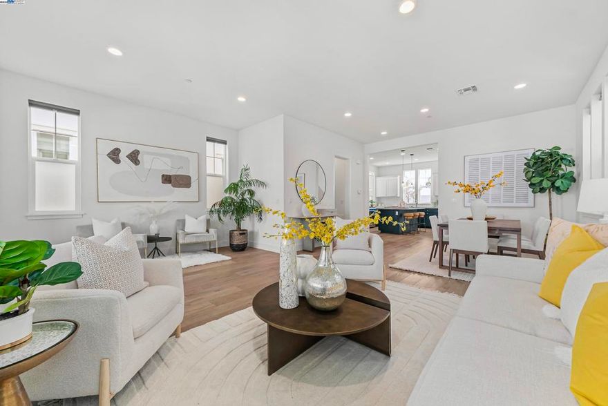 This stunning 4-bedroom, 3.5 bathroom home offers 2,410 square feet of thoughtfully designed space. The entire home boasts upgraded flooring with a mix of luxury vinyl plank and carpet. The first floor presents a private suite complete with a bedroom, a full bathroom, kitchenette, and washer and dryer, perfect for guests or multi-generational living. Enjoy the convenience of a private entrance to this suite, offering independence and privacy. Ascend to the second floor, where the 10-foot high ceilings create an expansive living space, seamlessly connecting the kitchen and dining area. An upgraded open-plan living area, featuring a sophisticated kitchen with an enhanced island and stainless steel appliances. The spacious covered patio is perfect for relaxing or entertaining. The home is equipped with a water softening system. The owned solar panel system, complemented by a Tesla battery, underscores the home’s commitment to sustainability and energy efficiency. The community is close to Meta and Tesla, among other major employers. The residents enjoy a host of amenities like a park, a kid's playground, BBQ and picnic area. Nearby National Wildlife Refuge offers open space with trails and nature to explore. Easy access to Dumbarton bridge and I-880.