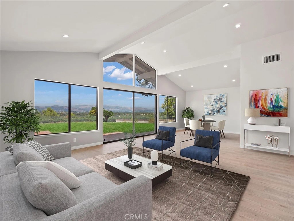 Look no further than this gorgeous home located in one of the most sought after neighborhoods in Calabasas. This home features recently remodeled floors, bathrooms, recessed lighting throughout and large windows, flooding rooms with natural light. The kitchen has been recently redone and features stainless steel appliances. The master suite includes a tranquil private patio. With three full bedrooms and bathrooms, and ACCESS TO THE CALABSAS LAKE, this home is a perfect fit for any family. The spacious living room opens to a large backyard, BBQ, and patio area with breathtaking panoramic views of the Calabasas Lake. Attached is a two-car garage with epoxy flooring. **Front and backyard lawn replaced with drought tolerant landscaping as seen in first two photos**