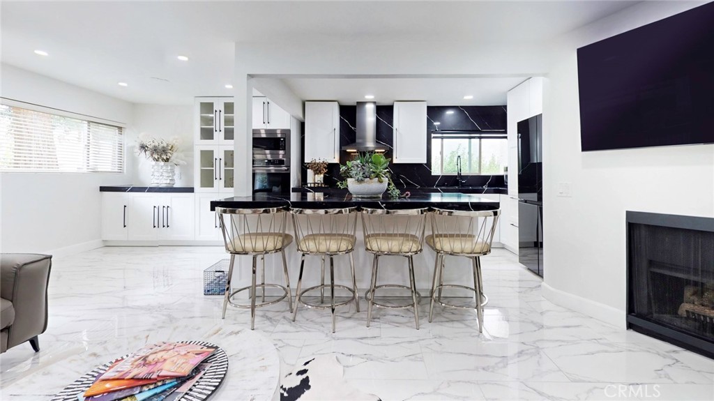 Beautifully updated 3-bedroom, 2-bath condo in the heart of Calabasas! This bright, first-floor unit offers an open floor plan with a modern kitchen featuring quartz countertops, a large island, upgraded lighting, and stylish finishes throughout. Enjoy spacious bedrooms, dual-vanity ensuite baths, in-unit laundry, recessed lighting, premium flooring, and a large private patio. Additional features include two side-by-side covered parking spaces and a private storage cabinet. Community amenities includes: pool, spa, fitness center, clubhouse, 24/7 security, and scenic walking trails. Residents also enjoy exclusive access to Private Calabasas Lake and the award-winning Las Virgenes School District. Conveniently located near The Commons, farmers market, tennis and swim clubs, hiking trails, and Malibu beaches.