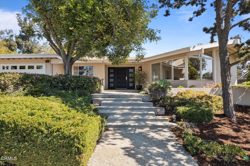 First Time on the Market - Timeless Mid-Century Gem on a Spacious Barranca Lot!Welcome to 262 Crestwood Avenue--a rare opportunity to own a custom-built mid-century modern home in one of Ventura's most desirable neighborhoods. Offered for the very first time since it was built in 1965, this 5-bedroom, 3-bathroom single-level home spans 3,228 sq ft and rests on an expansive 15,681 sq ft barranca lot, offering space, character, and endless potential.Step into the sun-drenched living room and be immediately captivated by soaring vaulted ceilings, a dramatic brick fireplace, and an iconic wall of picture windows that flood the space with natural light and frame serene views of the mature front landscaping. Period furnishings and original mid-century details reflect the authenticity and care poured into this home across generations.The heart of the home features a thoughtful layout perfect for multigenerational living, including a private primary suite and office located at the front of the home, while three additional bedrooms and two bathrooms are tucked off the expansive family room--also with vaulted beam ceilings and a second brick fireplace. Enjoy cozy evenings or morning coffee while overlooking the tranquil backyard through oversized windows that bring the outdoors in.The kitchen, updated around the 1990s, offers generous space and layout flexibility for those looking to personalize while preserving the home's architectural integrity.Situated close to Arroyo Verde Park, top-rated schools, shopping, and with easy freeway access, this Crestwood classic is more than a home--it's a piece of Ventura history waiting for its next chapter.Don't miss your chance to own a true mid-century masterpiece with room to grow, restore, or reimagine.