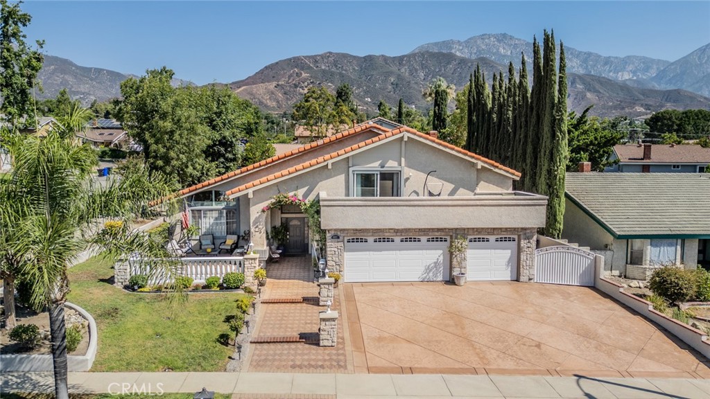 Welcome to this beautifully upgraded home located in the highly sought-after San Antonio Heights neighborhood of North Upland. With over $150,000 in upgrades, this distinctive 4-bedroom, 3-bathroom residence offers unmatched value and style — truly one of a kind in the area.
Step inside to a bright and inviting open-concept layout, featuring a gourmet kitchen with high-end appliances, a massive center island, and a skylight that fills the space with natural light. The kitchen flows seamlessly into both the spacious family room and living room, each with its own cozy fireplace — perfect for entertaining or relaxing evenings at home.
The downstairs bedroom and full bath offer flexibility for guests or multigenerational living, while upstairs, you'll find three generously sized bedrooms, including a luxurious primary suite and remodeled bathroom with a private balcony and open views.
Step outside through French doors to your beautifully landscaped backyard oasis, complete with a built-in storage room and ample space for gatherings, play, or a peaceful retreat.
Located on a quiet, well-maintained street in one of Upland’s most desirable communities, this home offers a rare blend of luxury, comfort, and location — the closest you’ll find to a custom-built home.
Don’t miss your opportunity to own this beautifully distinctive home in the prestigious Upland.